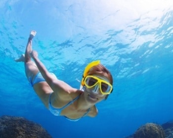 A woman snorkeling in Tenerife with GooDiving